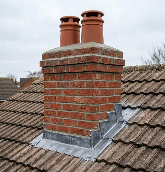 Chimney repair and flashing work on a roof in Redditch