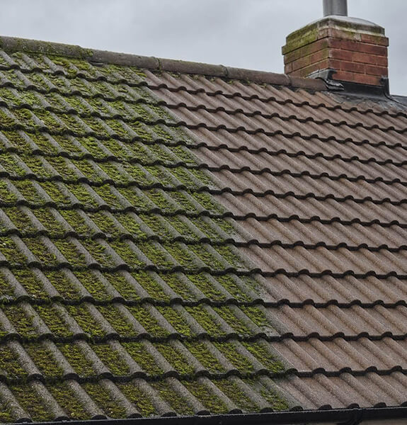 Roof cleaning and moss removal on a tiled roof in Redditch